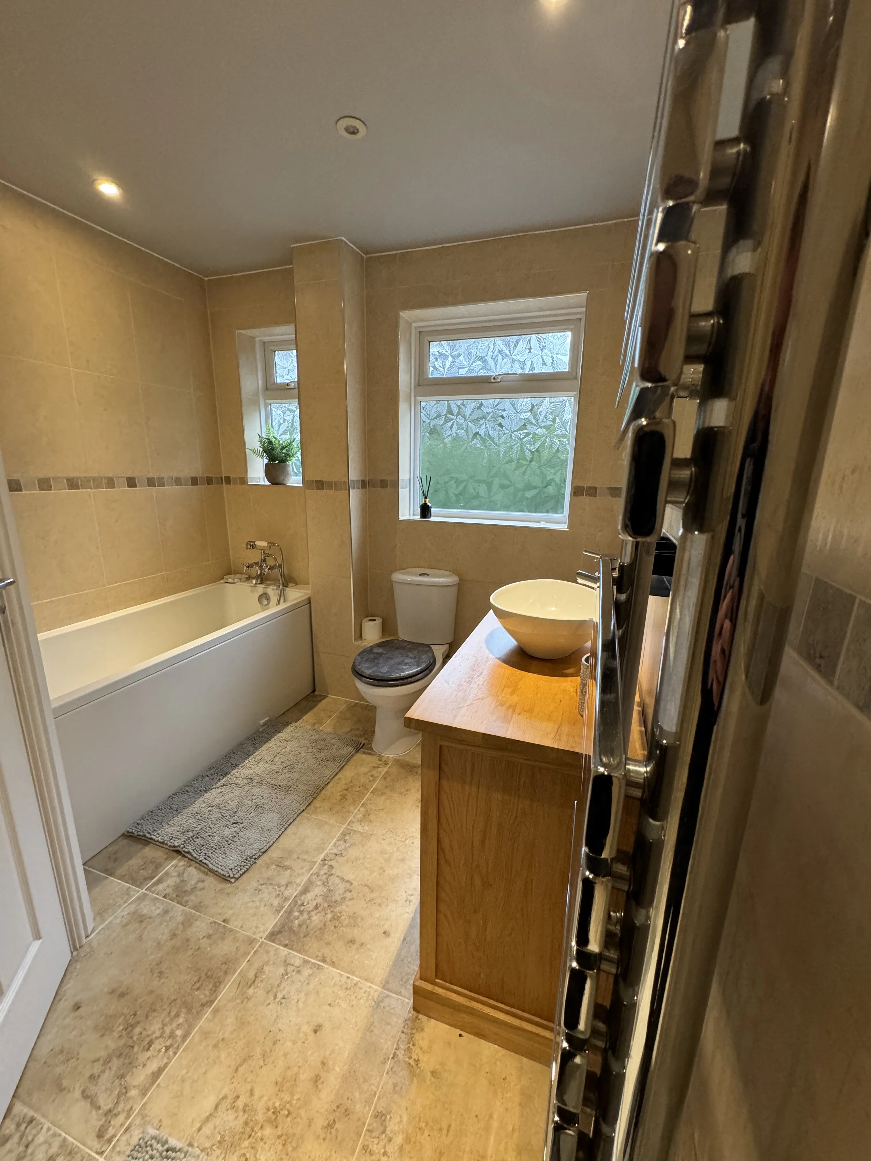 Full bathroom renovation with vessel basin and walk-in shower