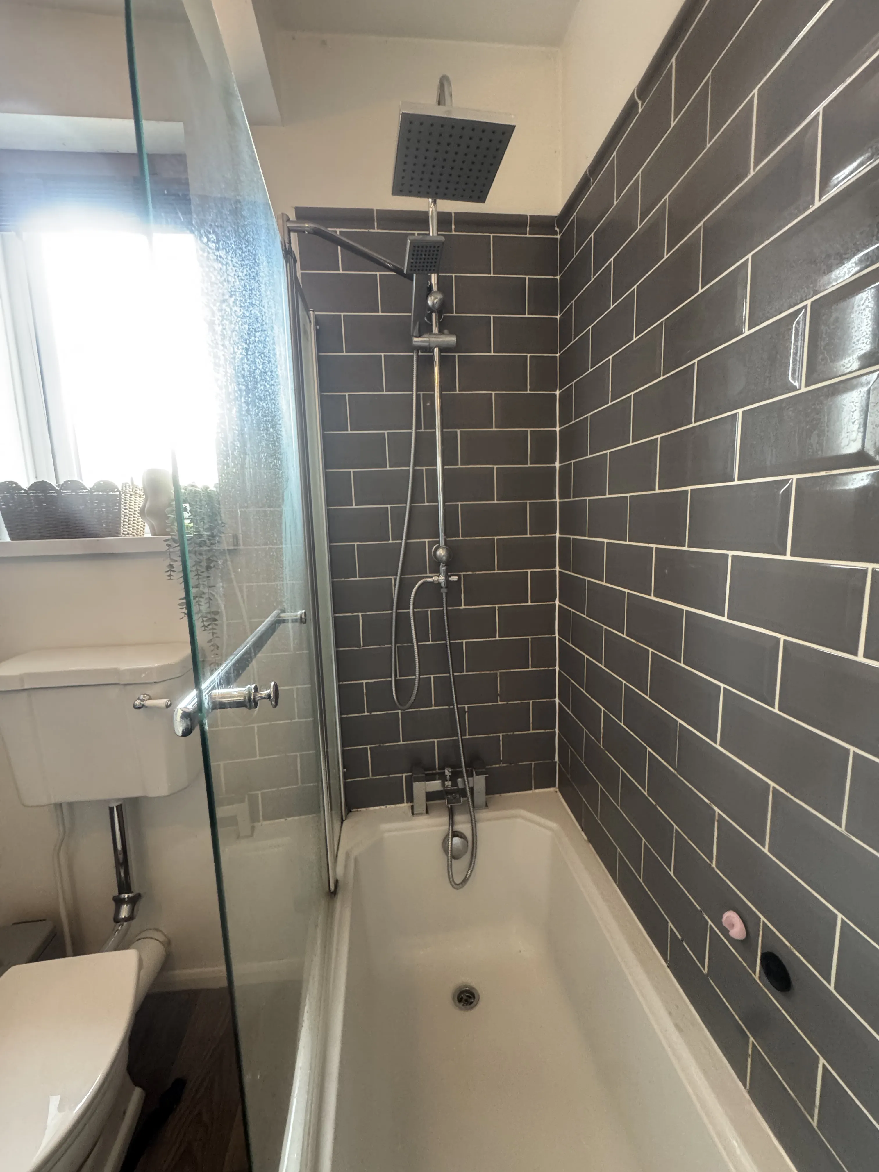 Grey metro tile bathroom with rainfall showerhead
