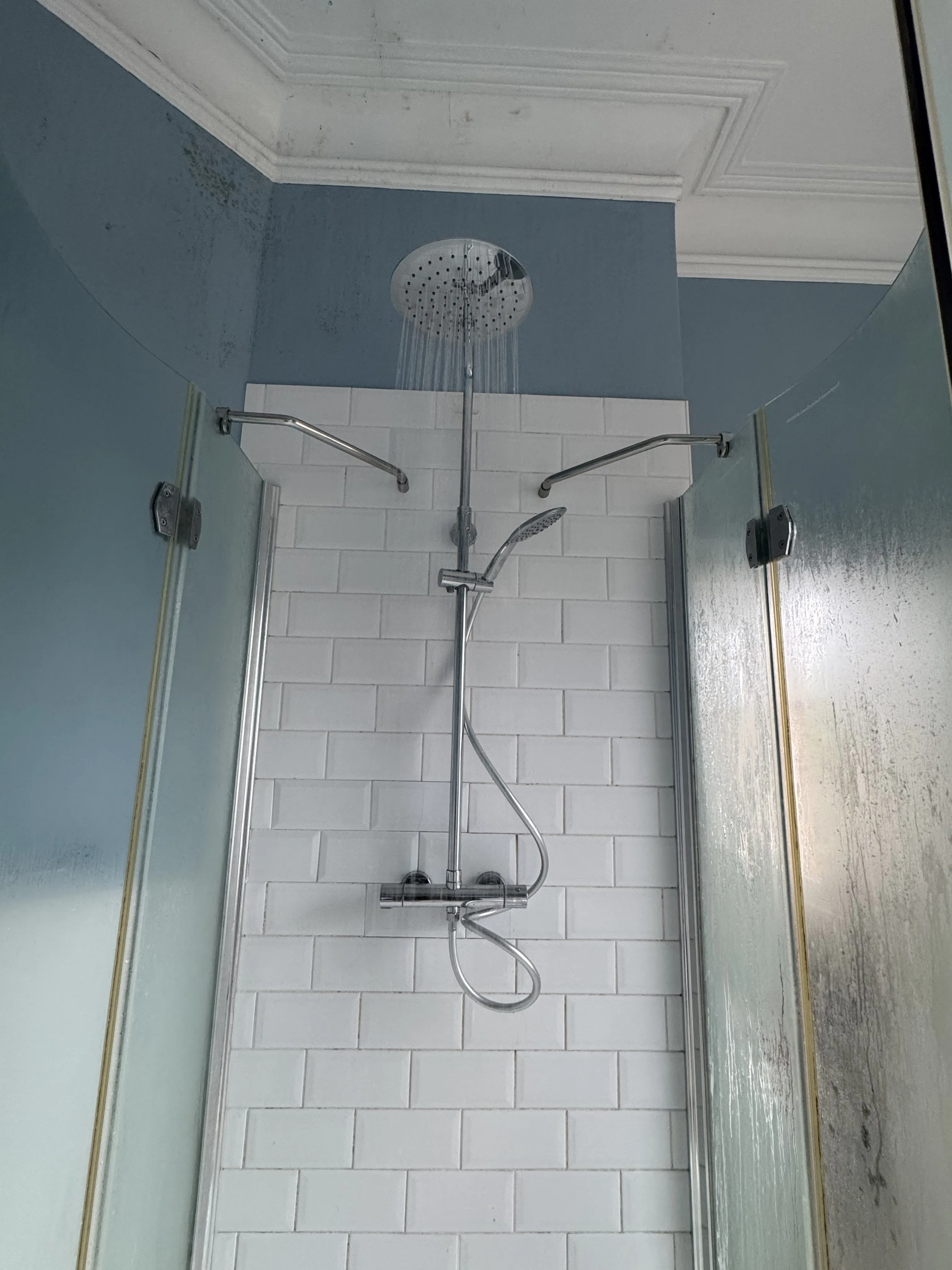 Rainfall shower with white metro tiles