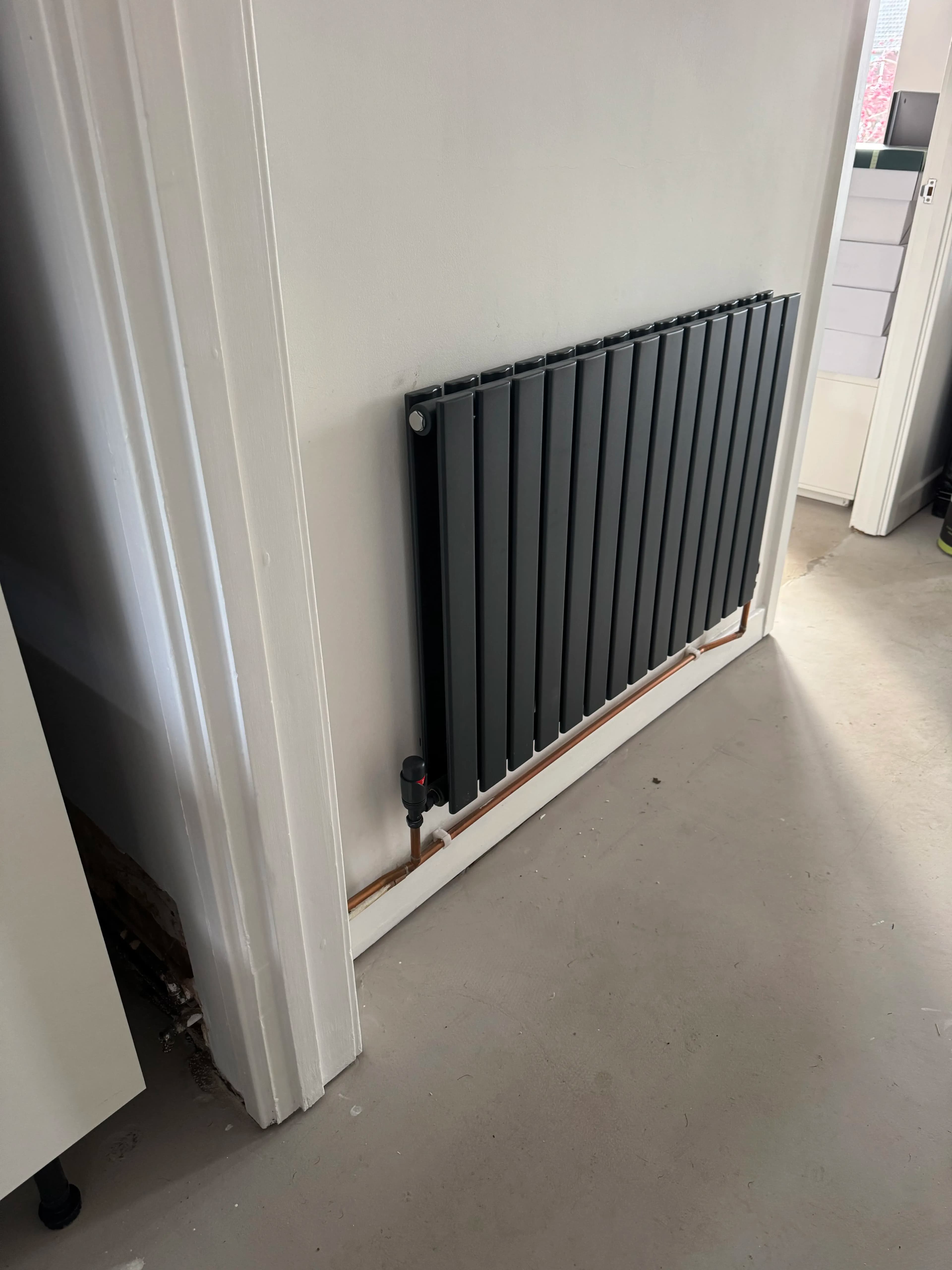Modern anthracite column radiator installation